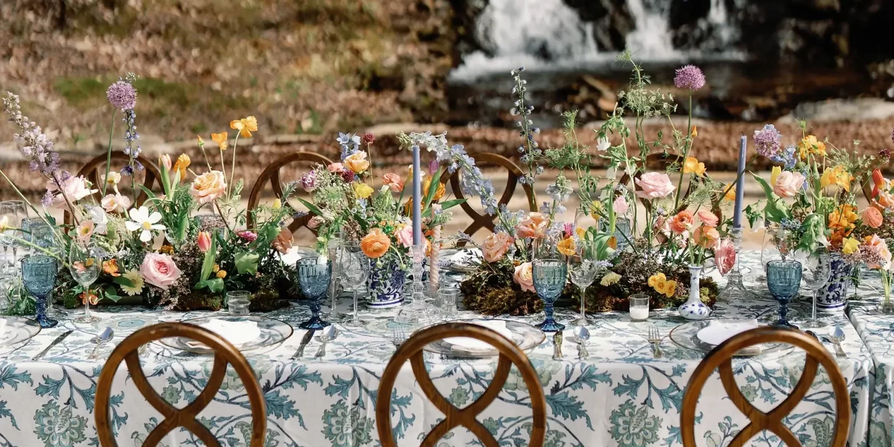 Wedding reception set up by a waterfall, located at The Falls at Blue Ridge